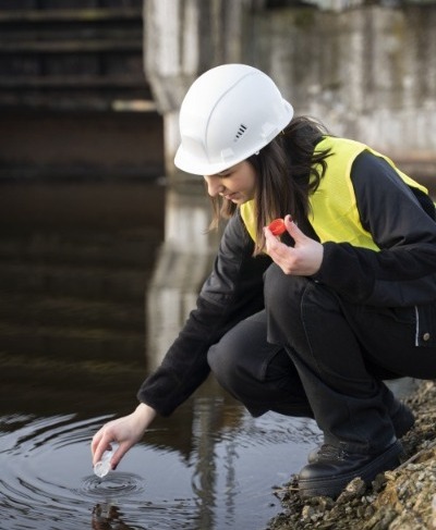 environmental-engineer-getting-water-sample-full-shot (1).jpg
